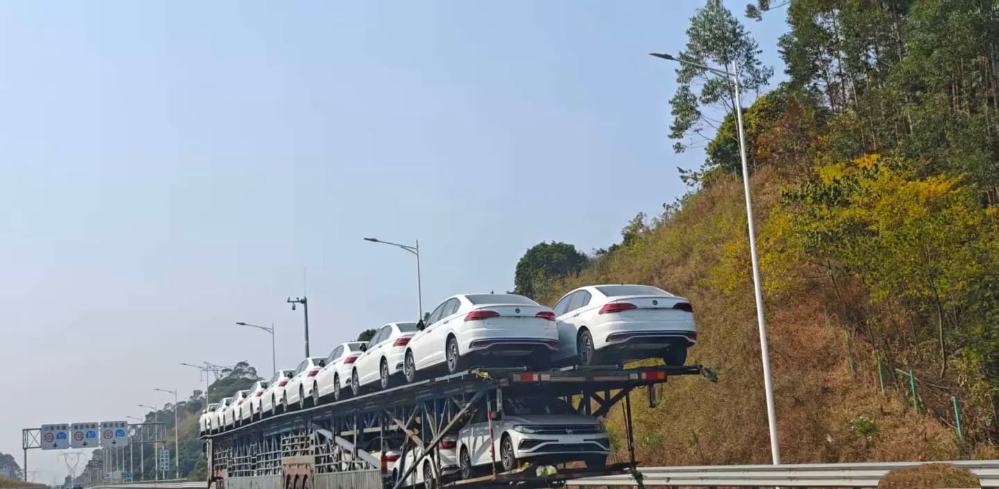Car trailer taking new vehicles to the port